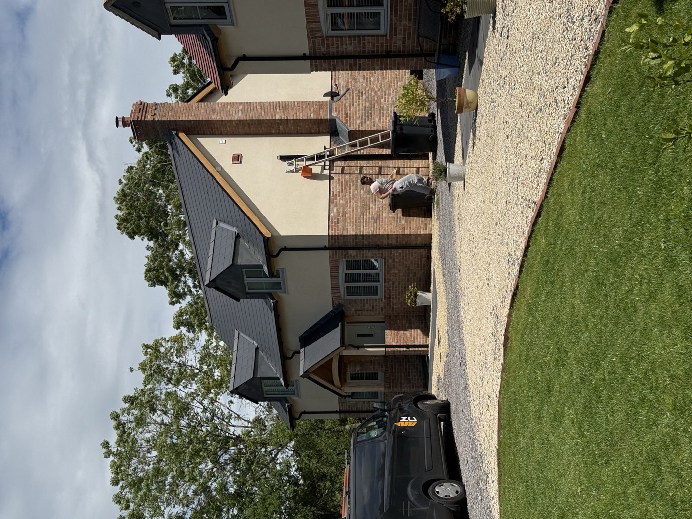 Completed cottage — front elevation with landscaping