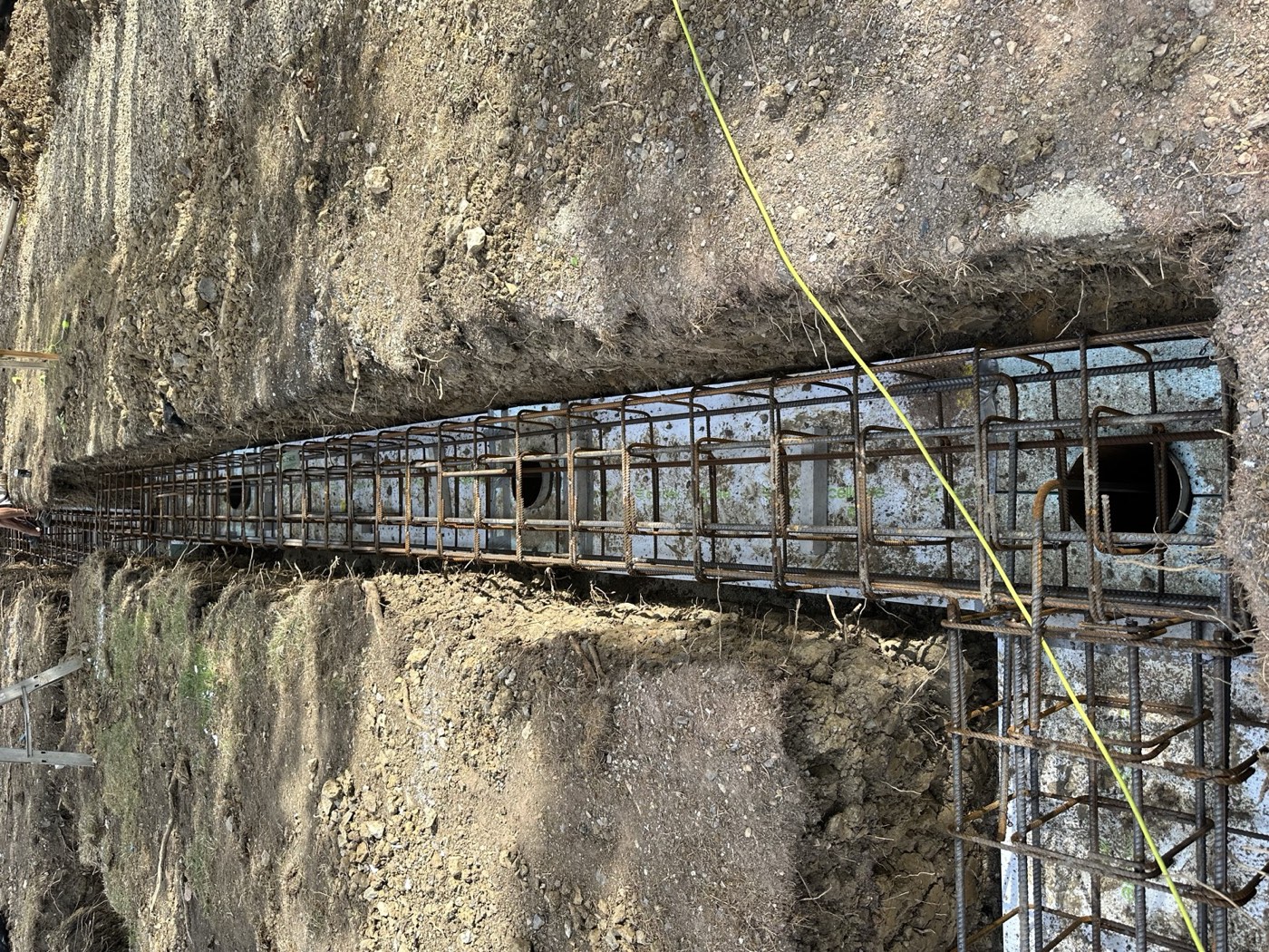 Reinforced steel ring beam in foundation trench