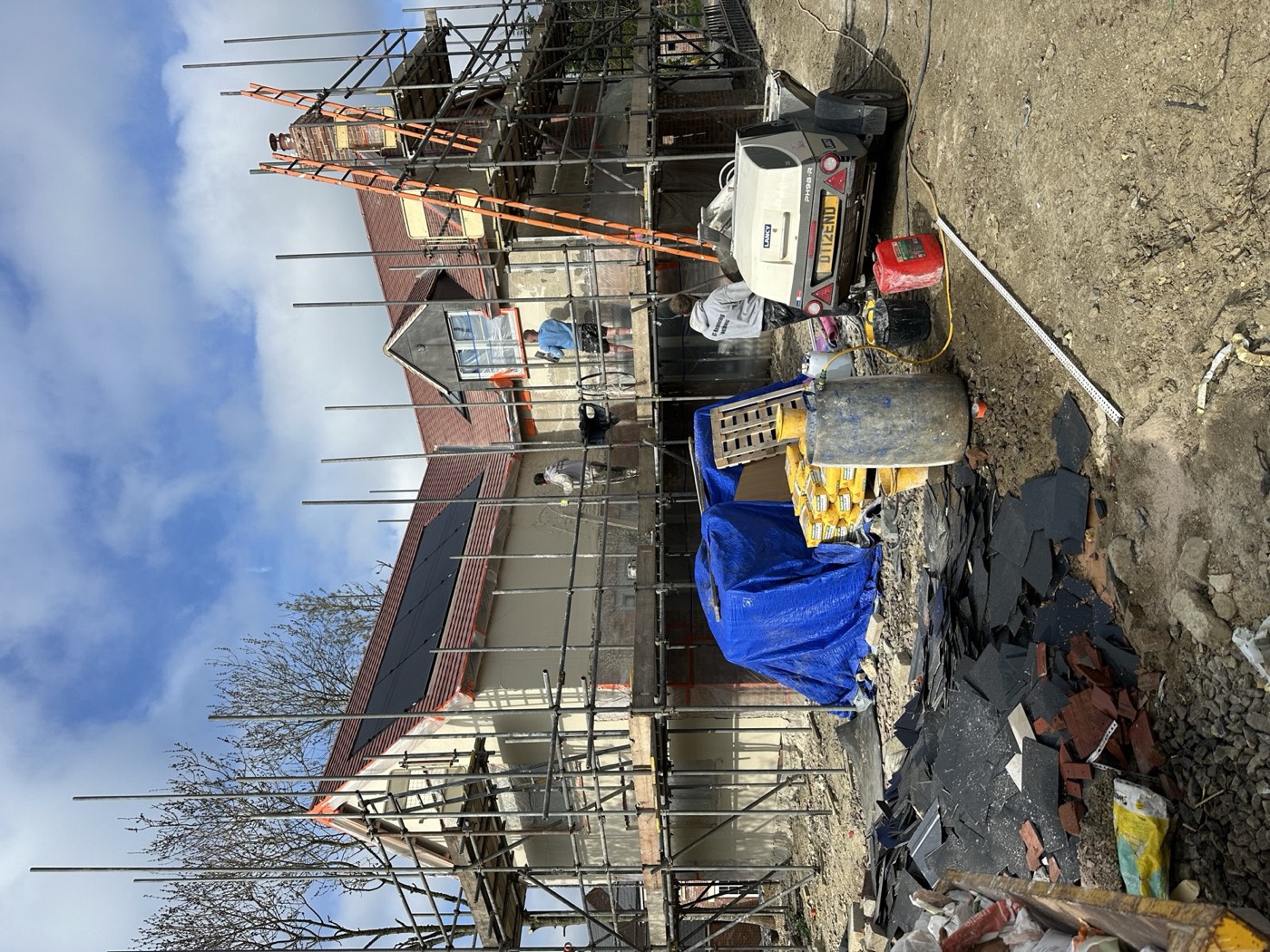 Both cottages under construction on site